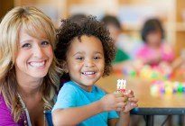 onsite childcare staff holding child at tazewell knoxville gym